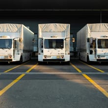 Row of trailers at warehouse dock doors