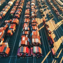 Aerial view of a container yard with trucks