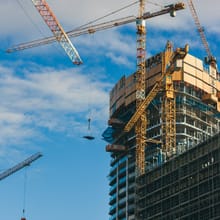 Building under construction with a tower crane