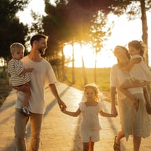 Family walking together at sunset