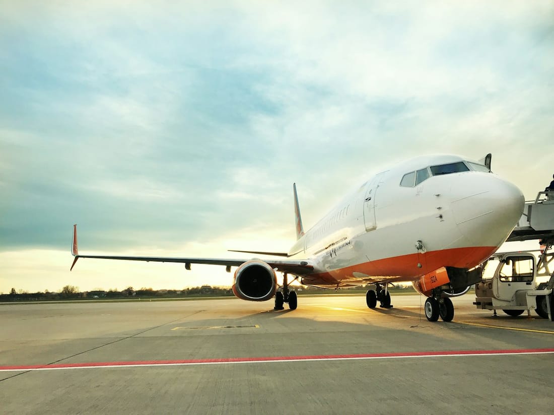 Airliner on the tarmac at sunset