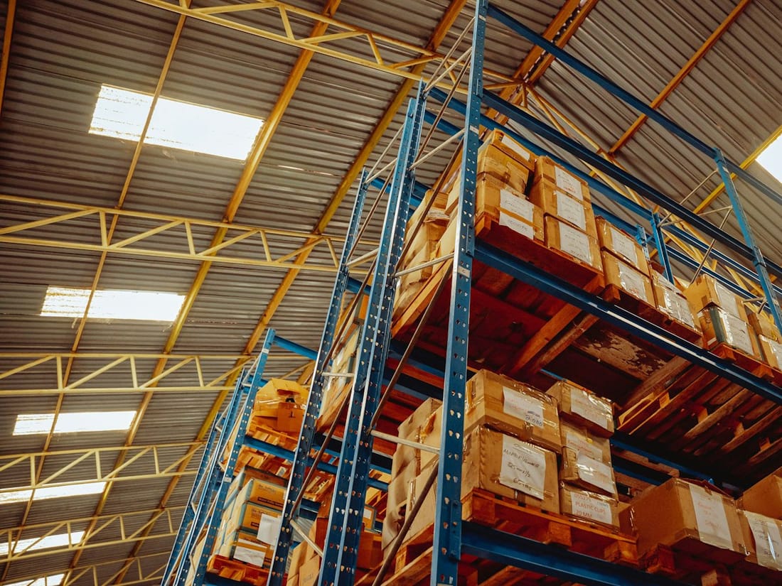 Palletized boxes stacked on warehouse racking